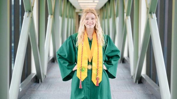 Dietz smiling in commencement gown