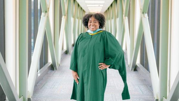 Jones smiling in commencement outfit